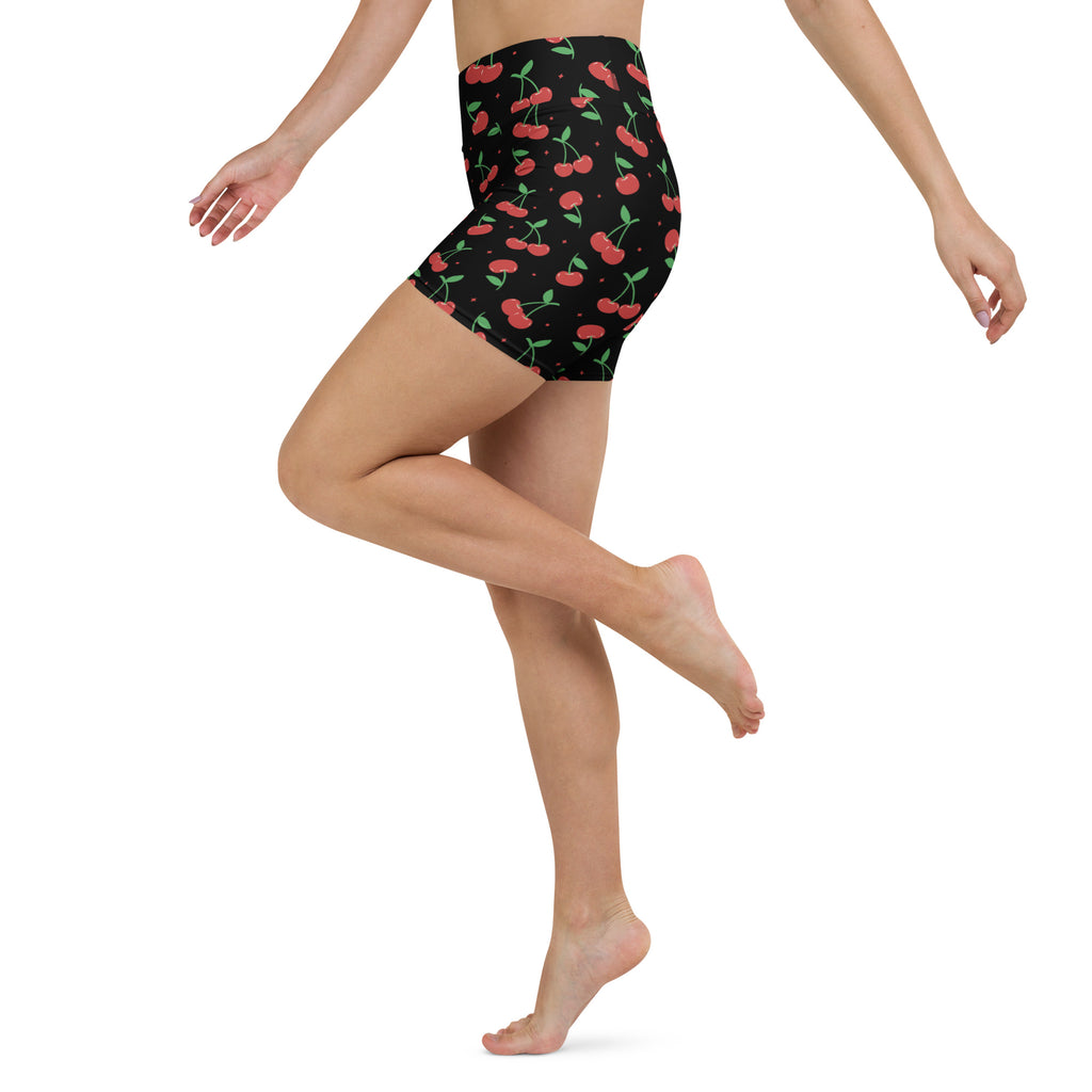 Women’s black high waisted buttery soft yoga shorts with vibrant red cherry and green stem pattern