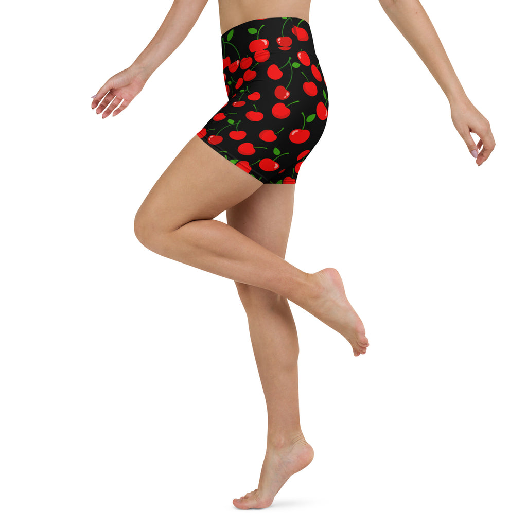 Women’s high waisted black cherry yoga shorts with vibrant red cherry pattern and buttery soft fabric for activewear