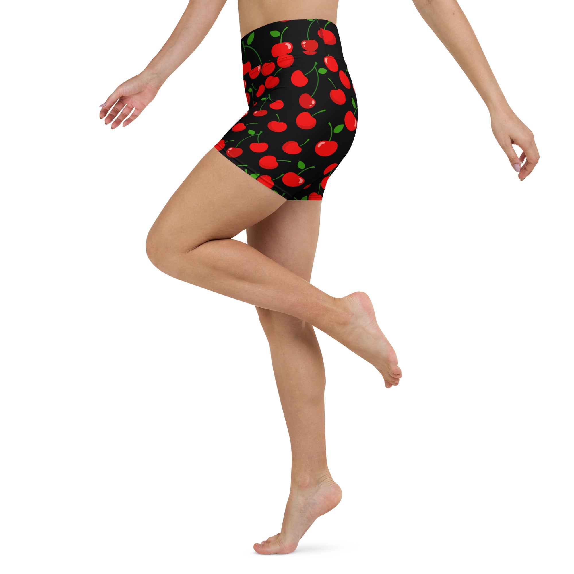 Women’s high waisted black cherry yoga shorts with vibrant red cherry pattern and buttery soft fabric for activewear