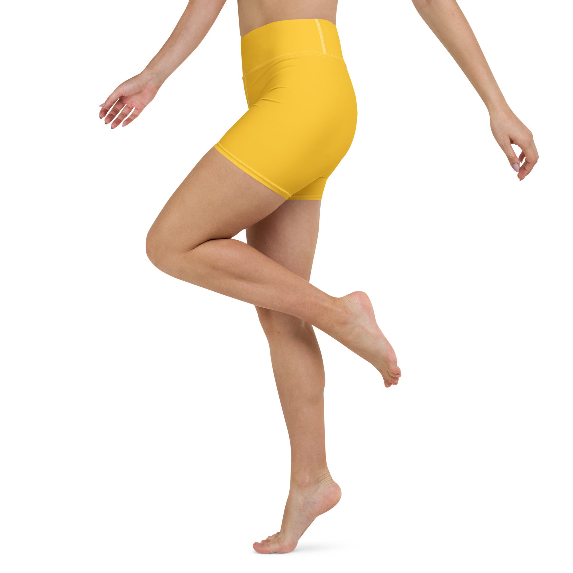 Bright yellow high-waisted women’s buttery soft yoga shorts made from soft active material for athletic use