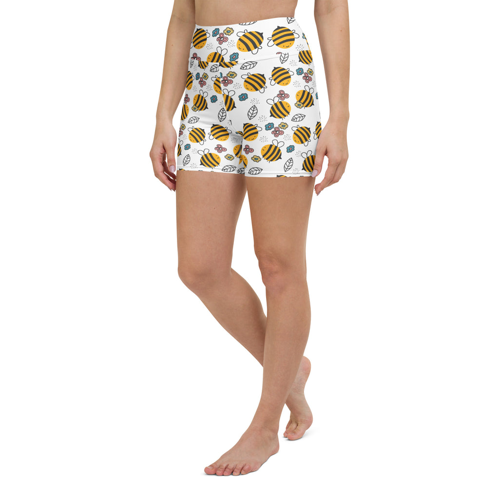 Women’s high waisted white buttery soft yoga shorts with yellow and black bumblebee and floral pattern