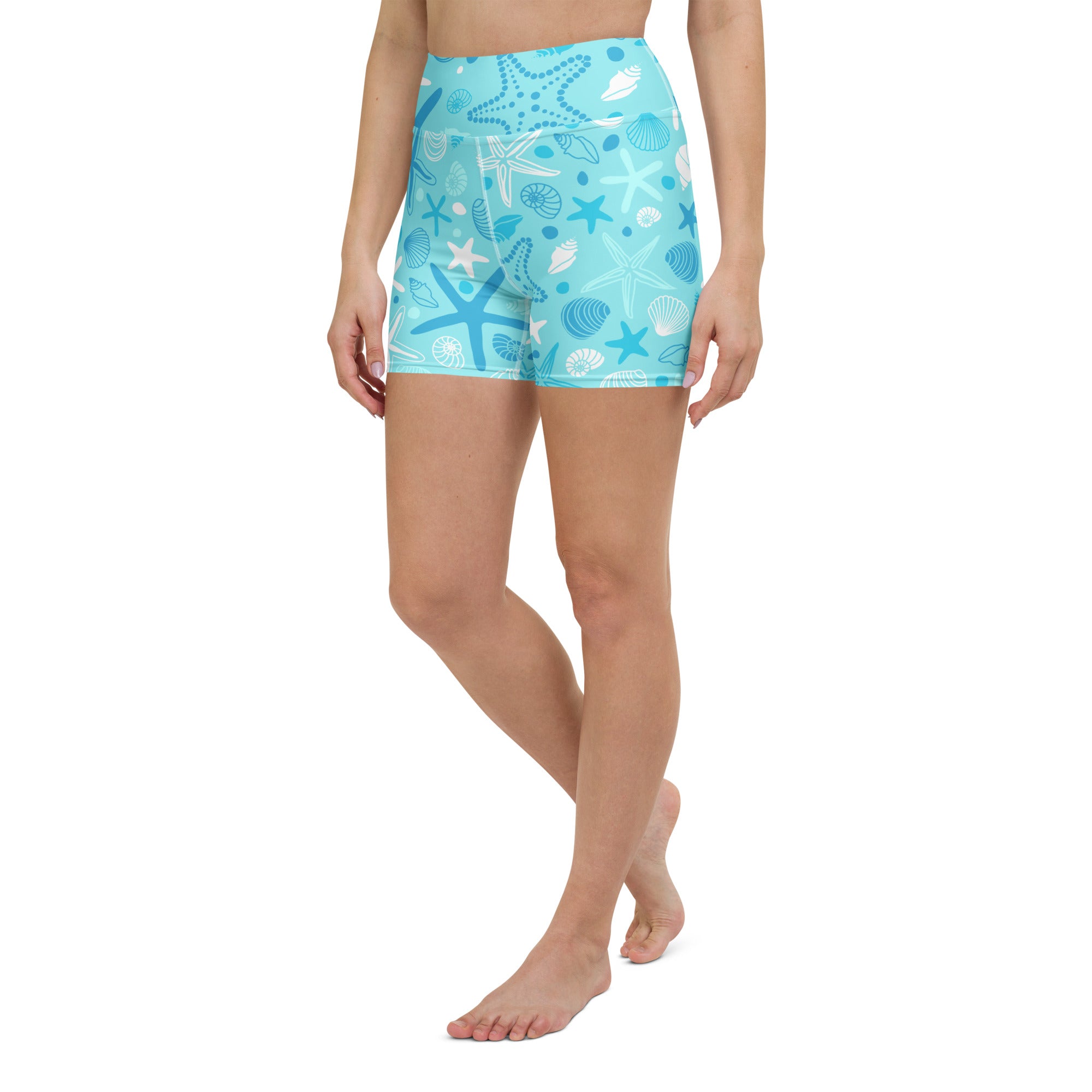 Women’s light blue high waisted buttery soft yoga shorts with white and dark blue starfish and shell patterns