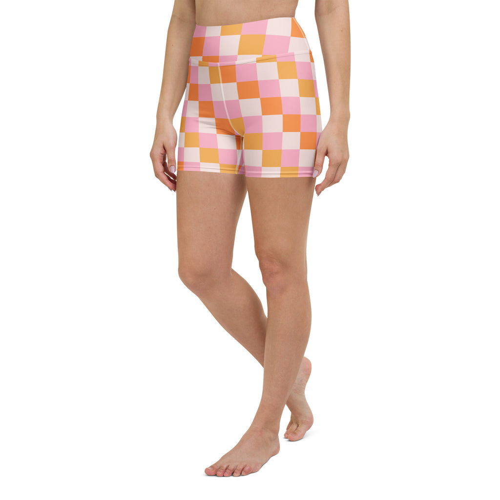 High waisted women’s yoga shorts in vibrant pink and orange checkered stretchy buttery soft fabric