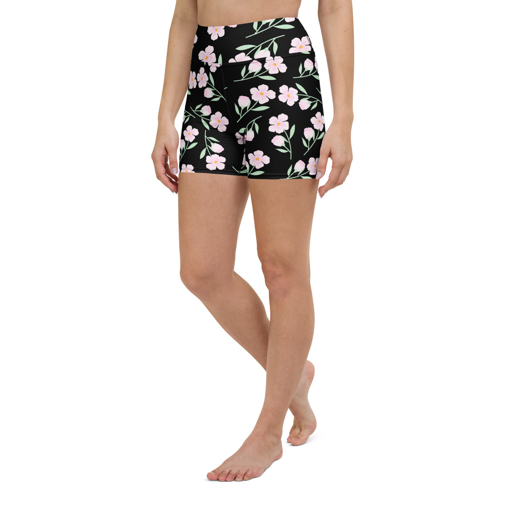 Women’s black high waisted buttery soft yoga shorts with delicate pink floral pattern and green stems