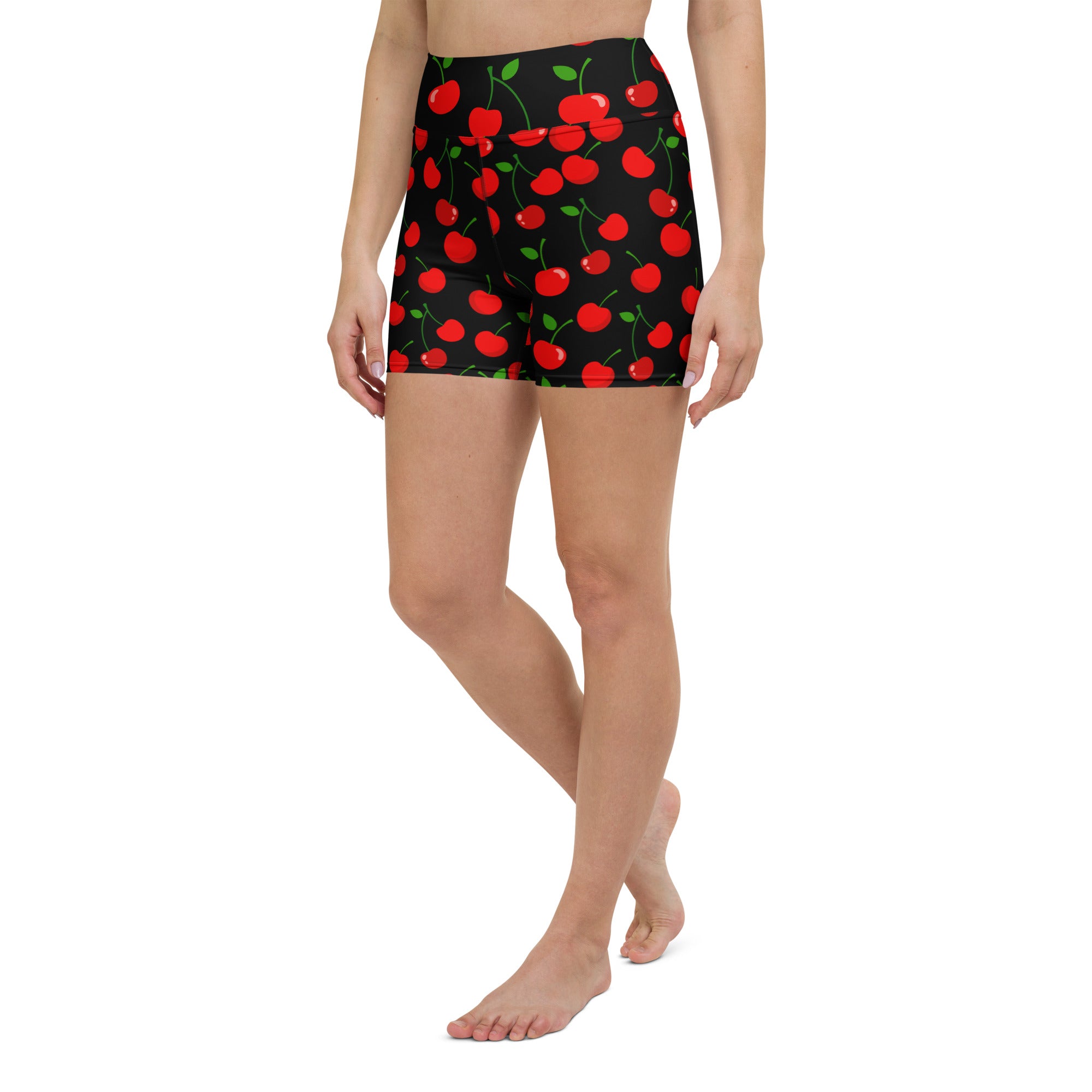 Black high waisted buttery soft women’s yoga shorts with vibrant red cherry pattern and green leaves for active wear