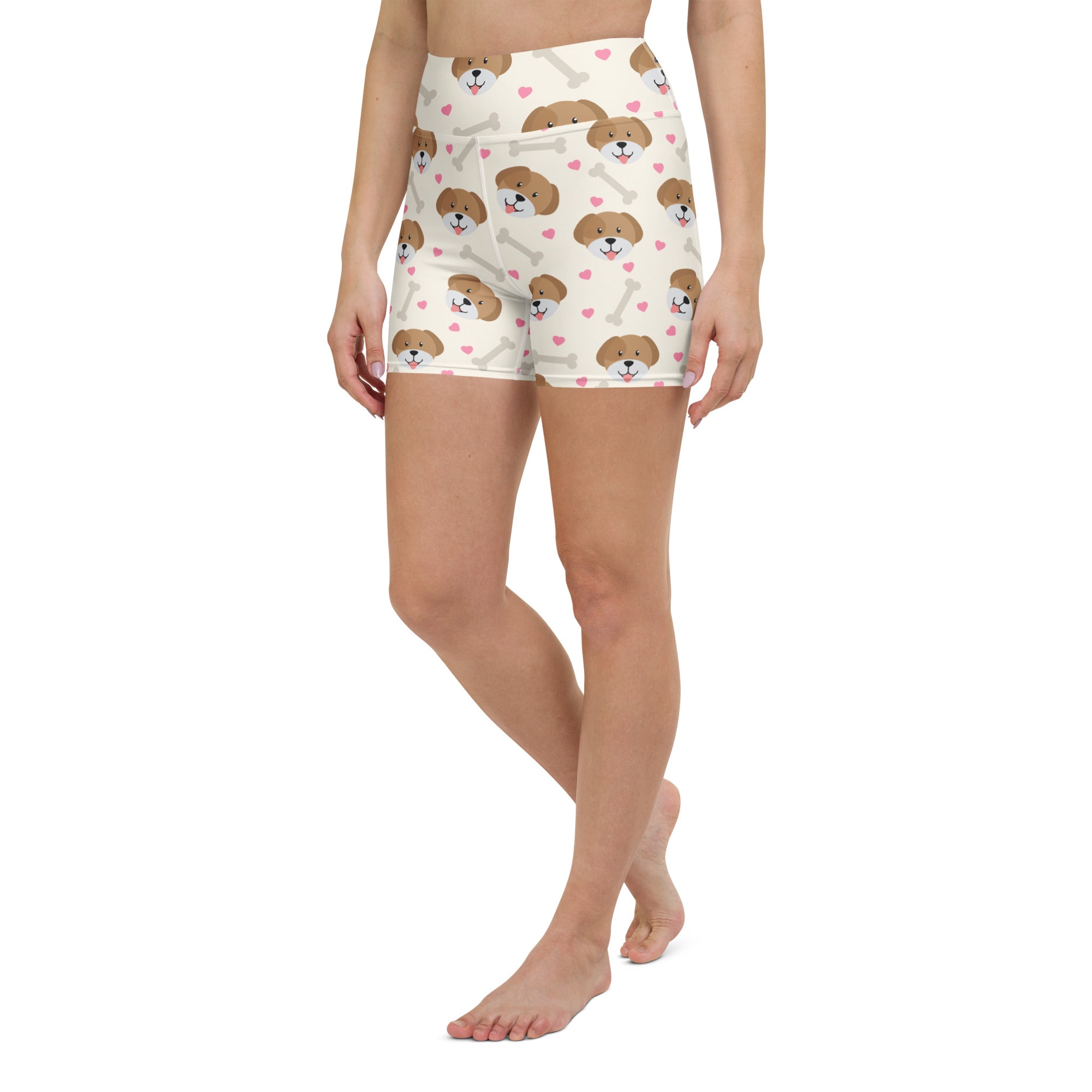 White high waisted buttery soft women’s yoga shorts with brown puppy faces pink hearts and white bones pattern