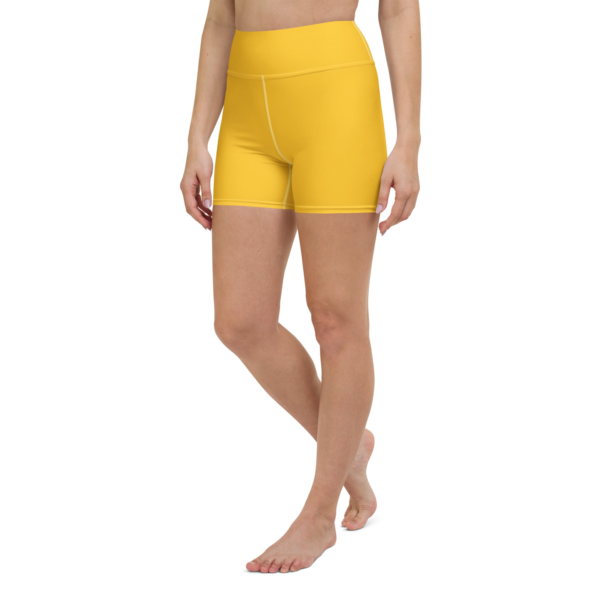 Women’s high waisted buttery soft yellow yoga shorts made of smooth stretchy fabric for active wear