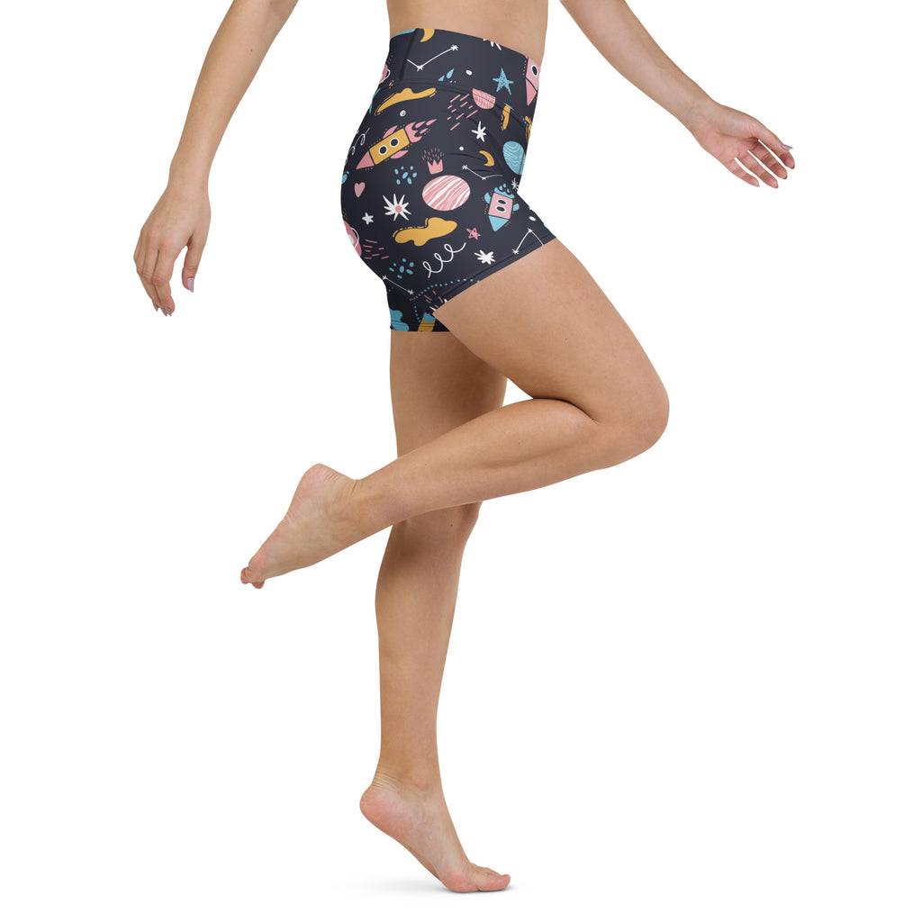 Women’s outer space yoga shorts in dark navy high waisted buttery soft fabric with colorful rockets planets and stars