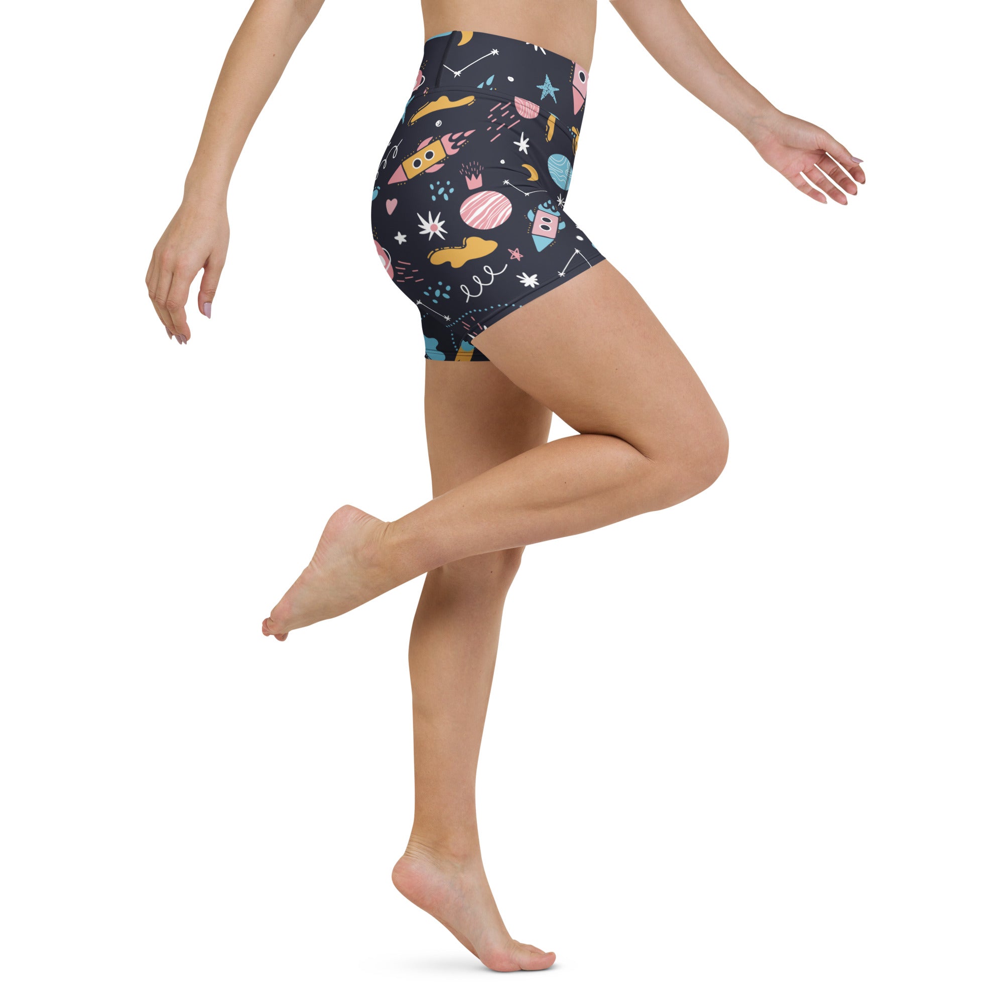 Women’s outer space yoga shorts in dark navy high waisted buttery soft fabric with colorful rockets planets and stars