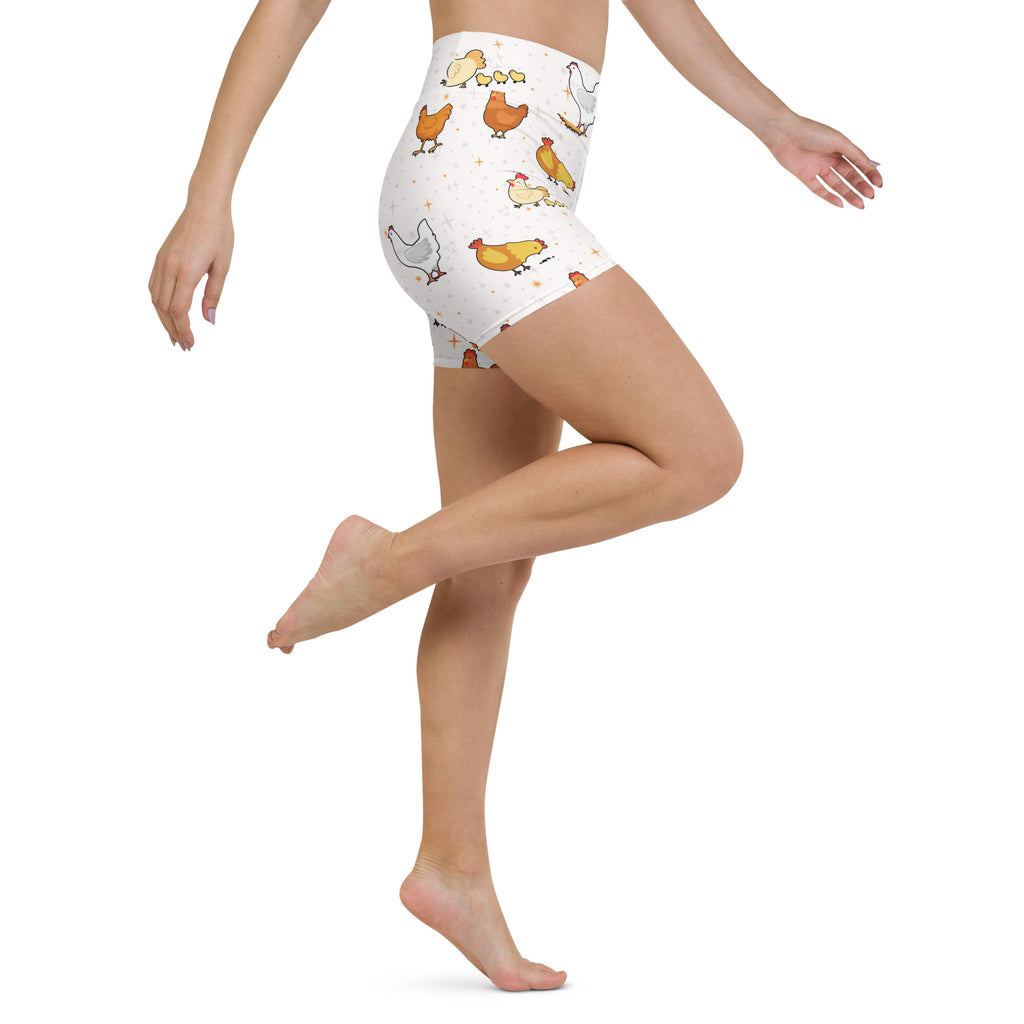Women’s white high waisted buttery soft yoga shorts with playful orange yellow and white cartoon chicken pattern