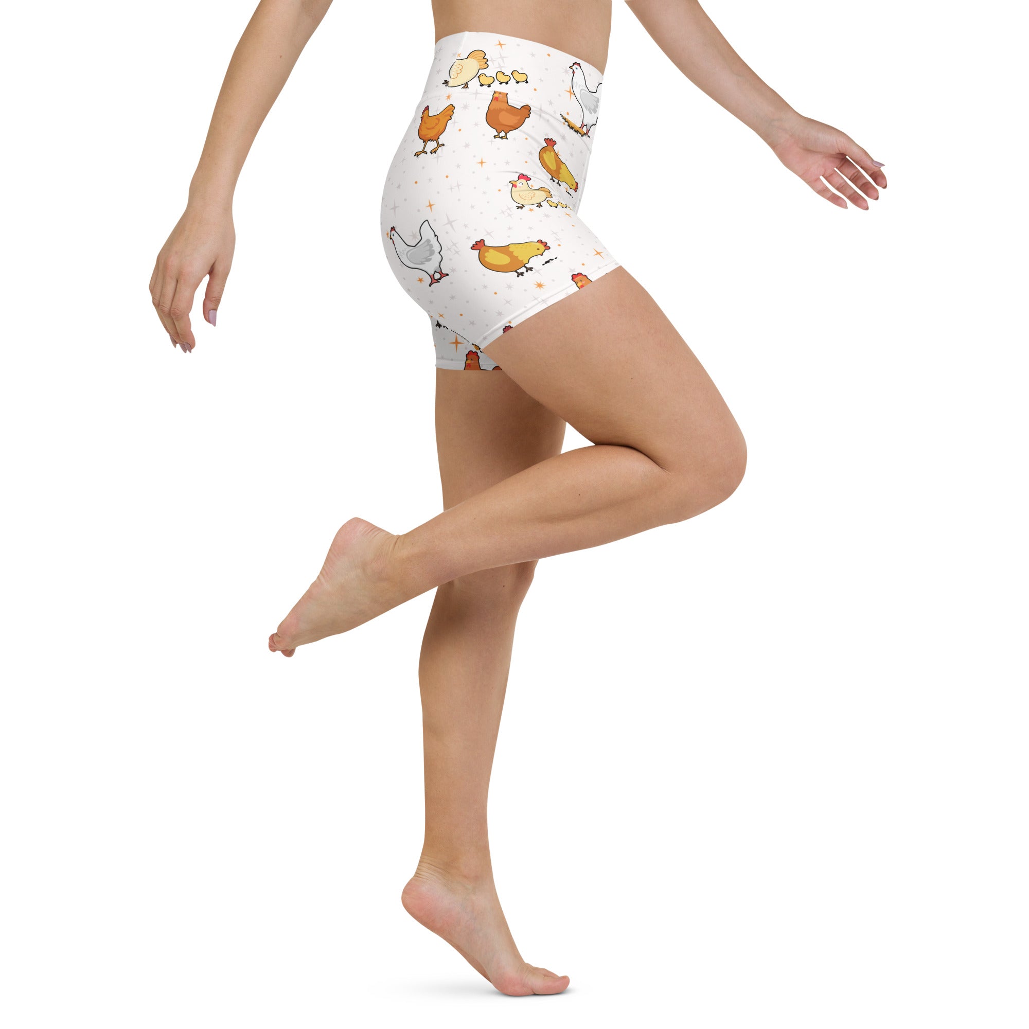 Women’s white high waisted buttery soft yoga shorts with playful orange yellow and white cartoon chicken pattern