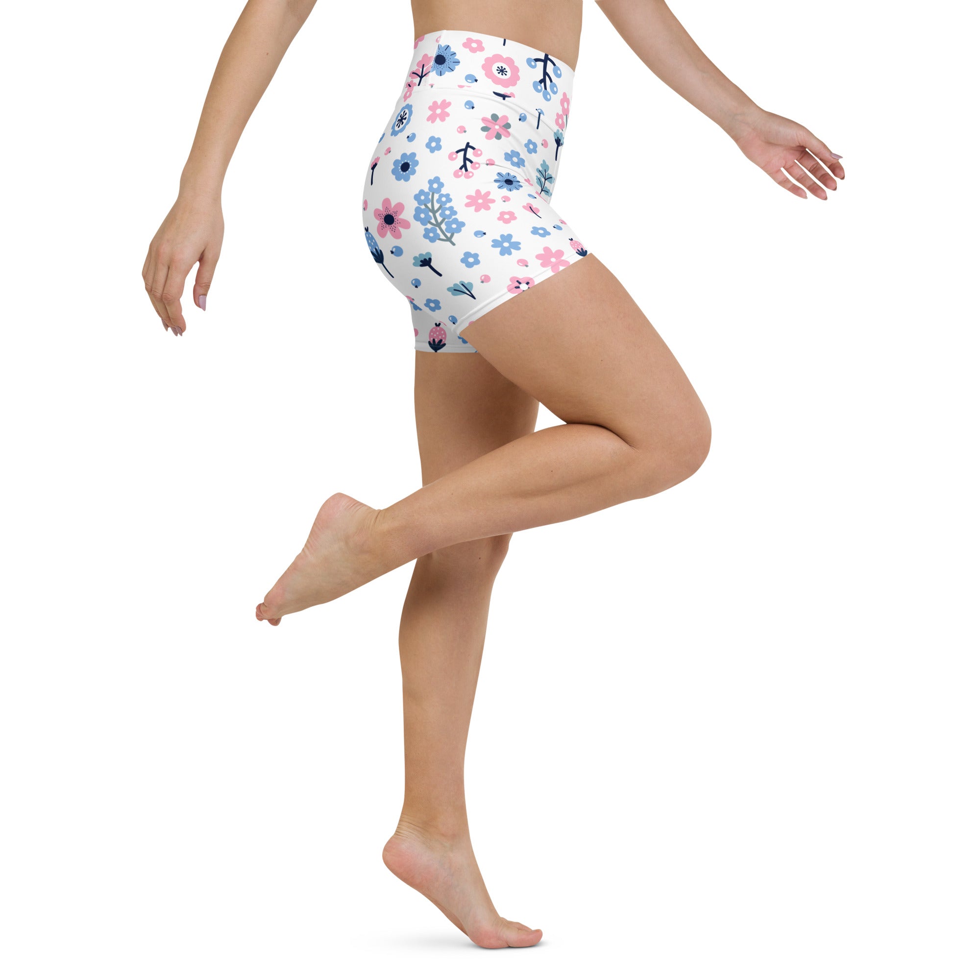White high waisted buttery soft women’s yoga shorts with pink and blue floral pattern and green stems