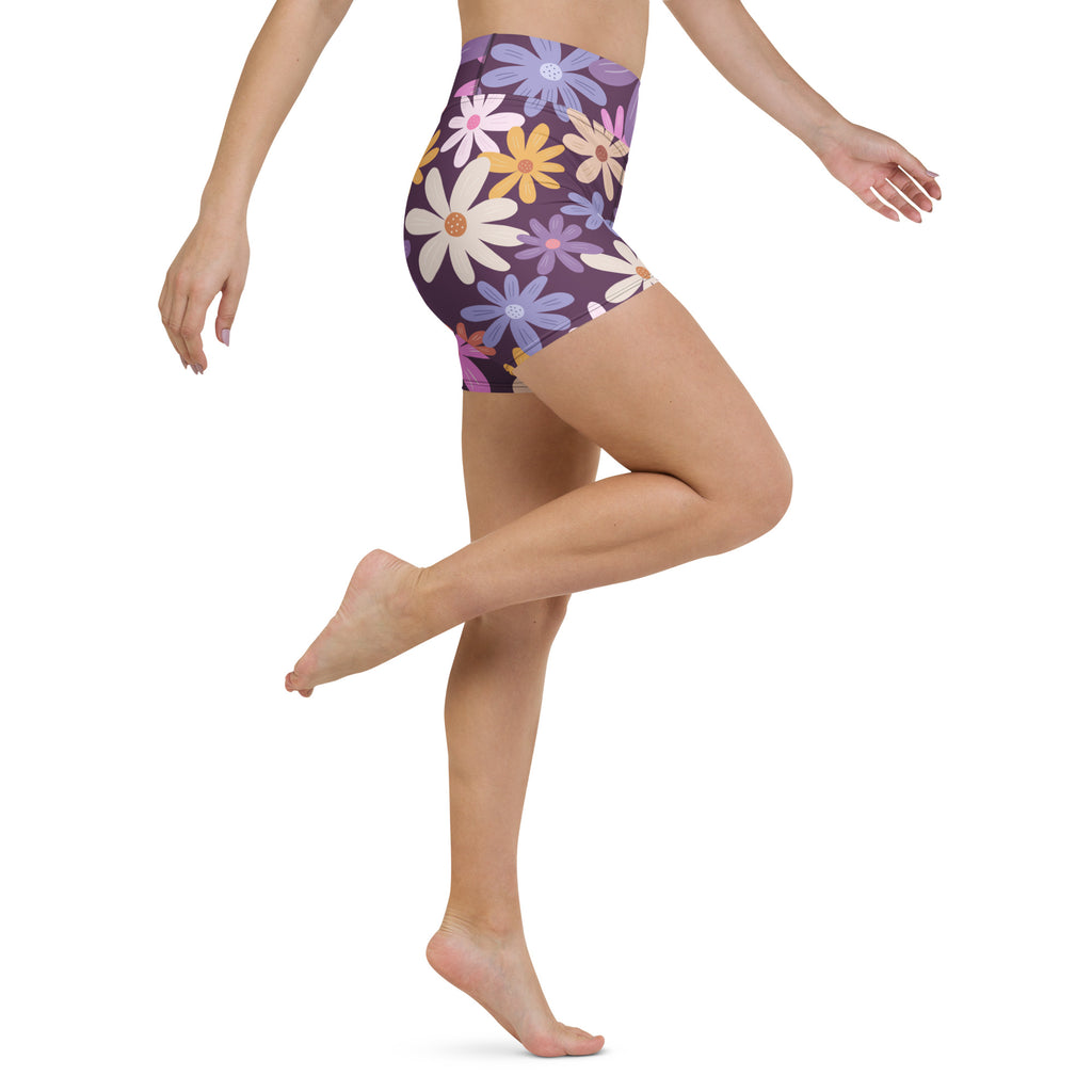 Women’s purple high waisted buttery soft yoga shorts with vibrant white yellow pink and blue daisy floral pattern