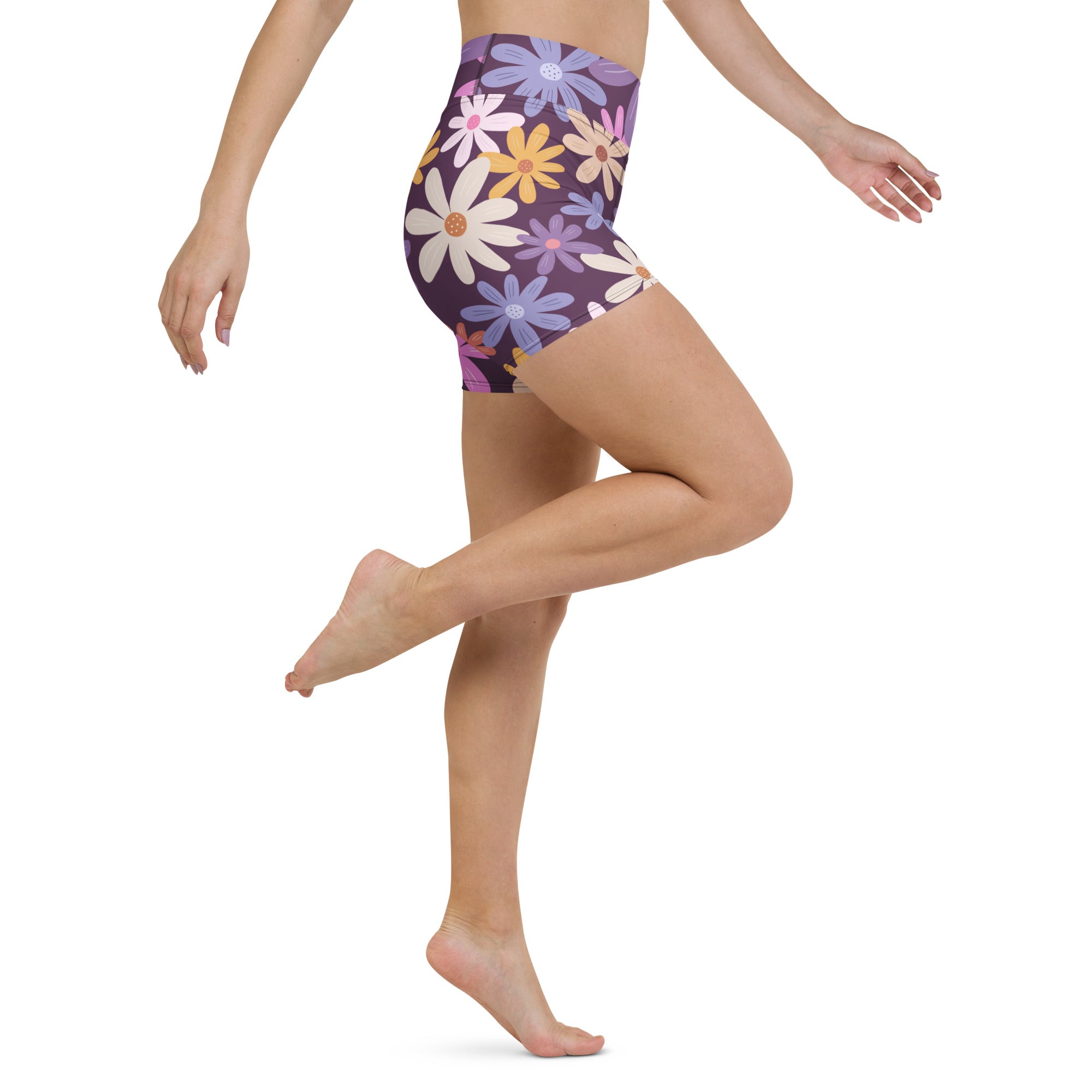 Women’s purple high waisted buttery soft yoga shorts with vibrant white yellow pink and blue daisy floral pattern