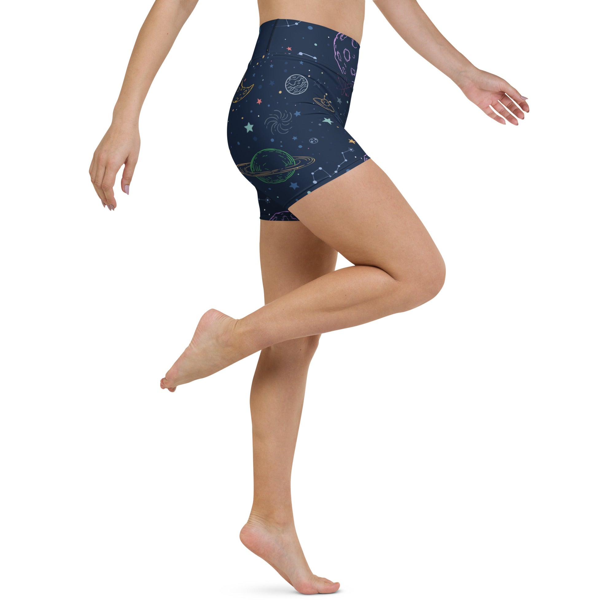 Dark blue high waisted buttery soft women’s yoga shorts with colorful glowing neon cosmic planets stars and constellations design