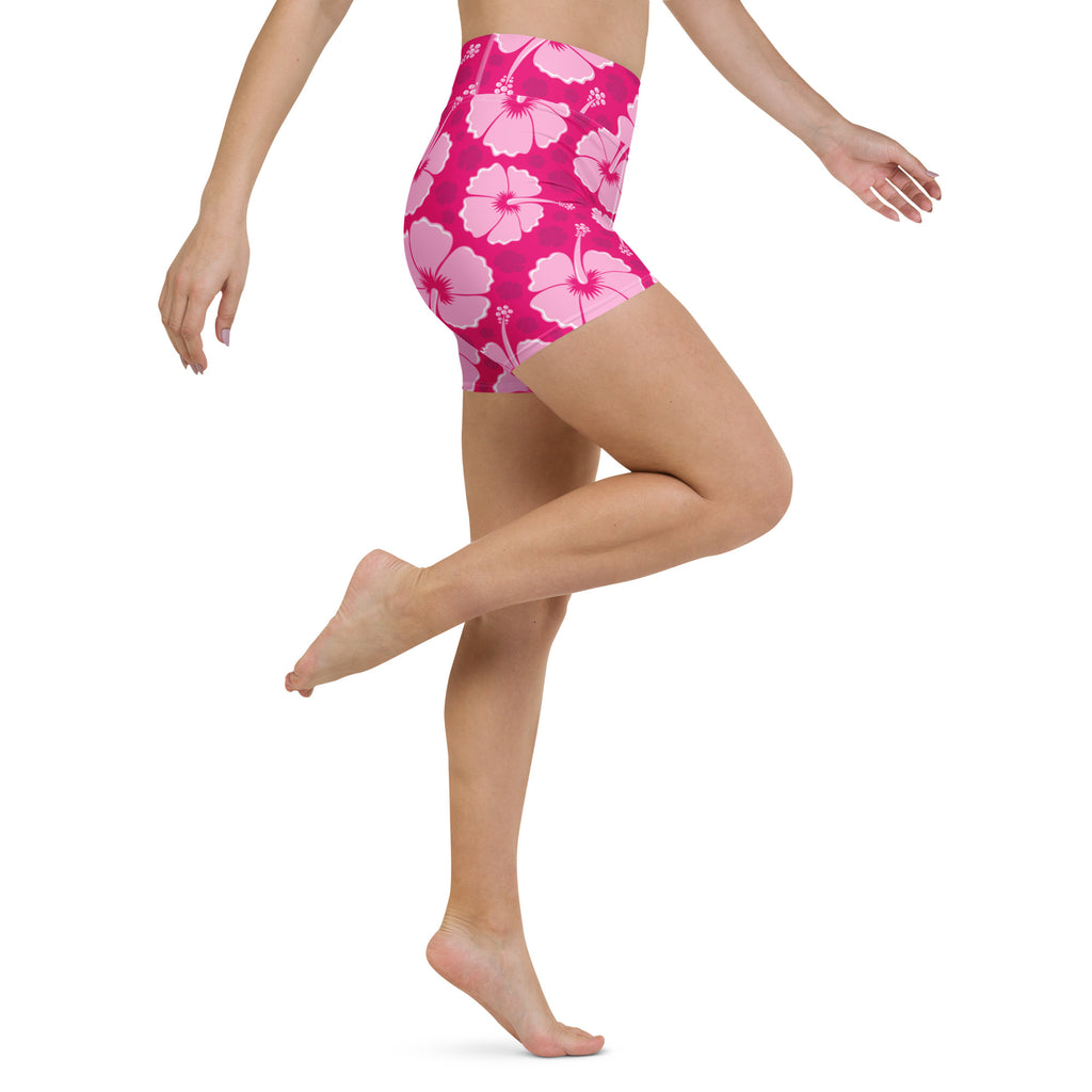 Bright pink high-waisted womens tropical hibiscus yoga shorts with buttery soft fabric and bold floral pattern