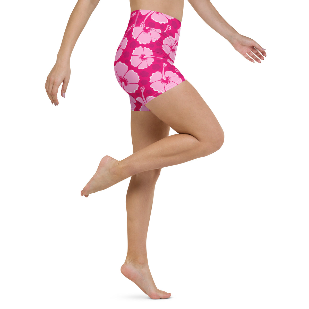 Bright pink high-waisted womens tropical hibiscus yoga shorts with buttery soft fabric and bold floral pattern