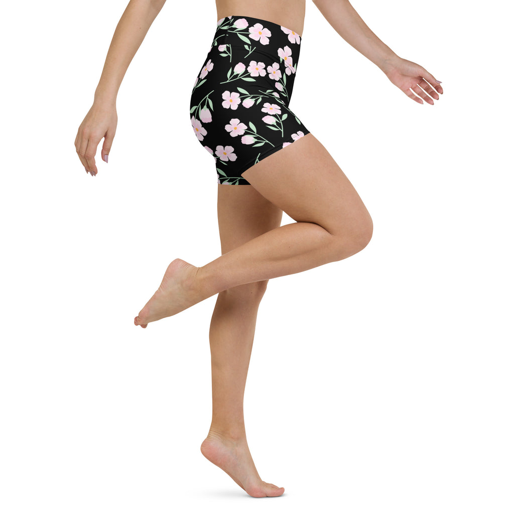 Women’s black high waisted yoga shorts with pink floral pattern buttery soft active pants front view