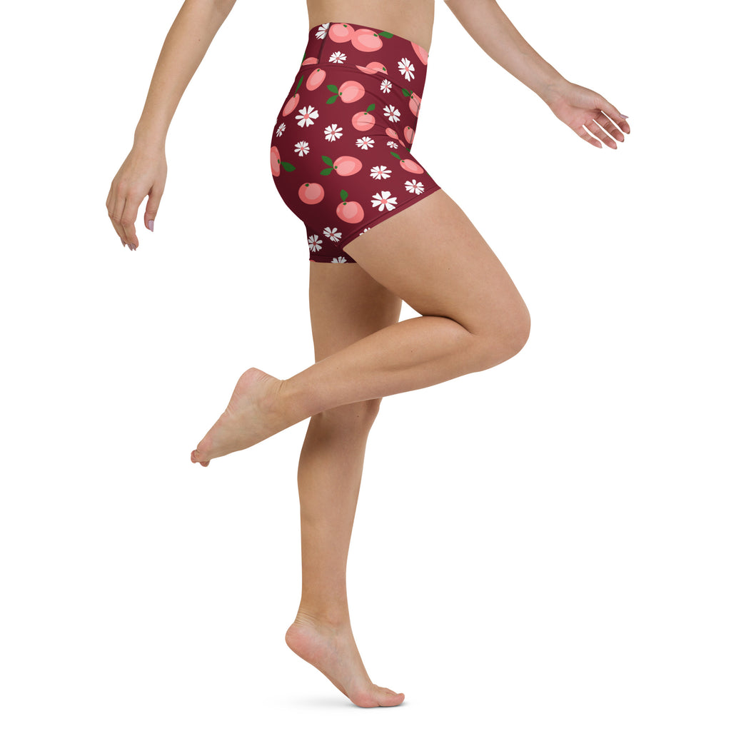 Women’s maroon high waisted buttery soft yoga shorts with playful pink peaches and white floral pattern
