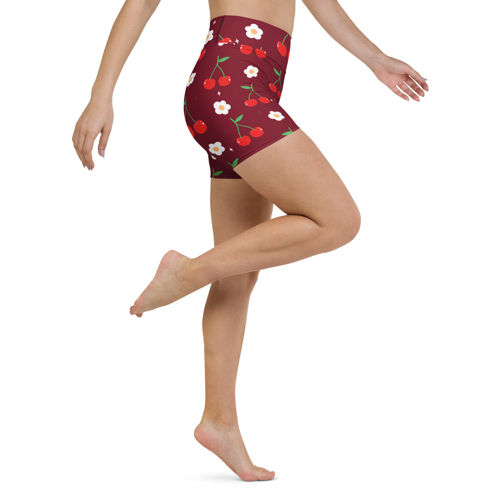 Women’s maroon high-waisted buttery soft yoga shorts with playful red cherry and white daisy pattern