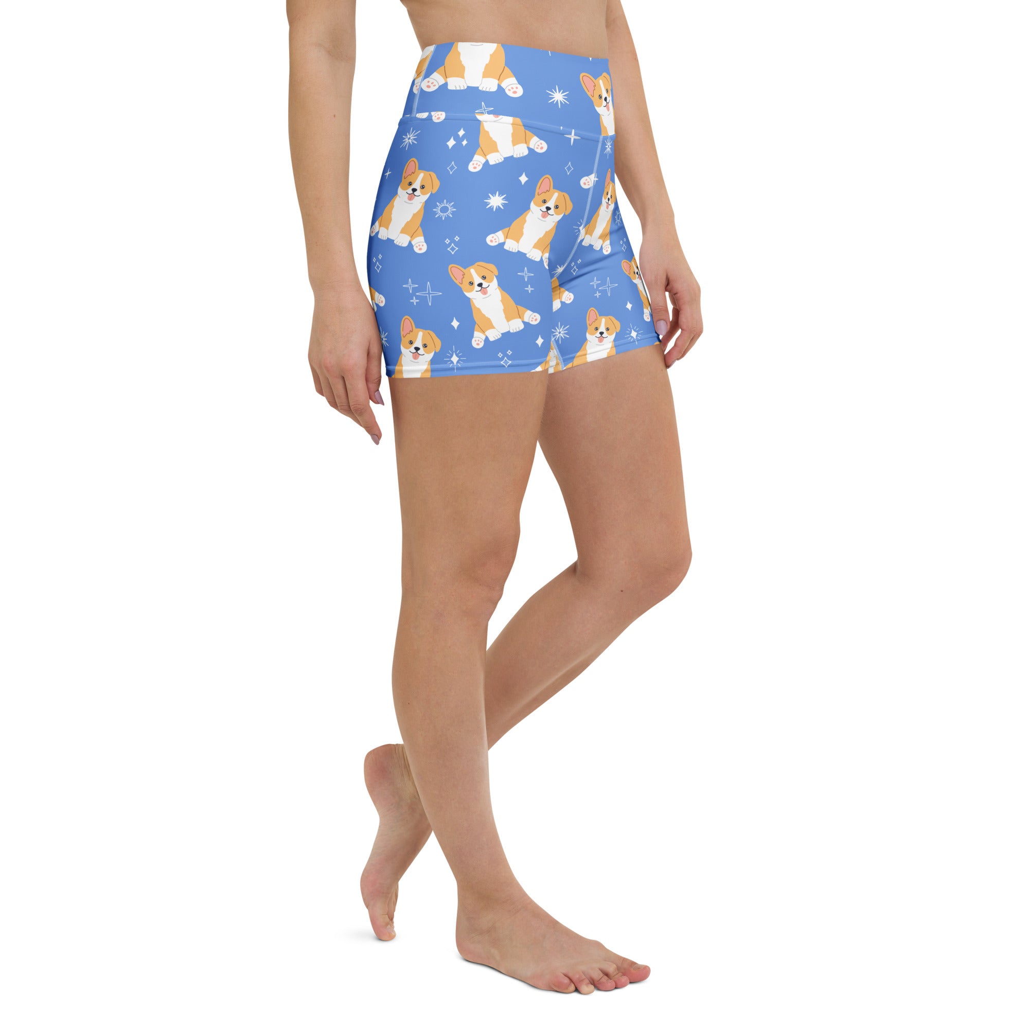 Women’s blue high waisted buttery soft yoga shorts with playful cartoon corgis and sparkles pattern