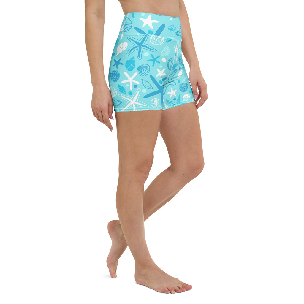 Light blue high waisted buttery soft women’s yoga shorts with white and dark blue starfish and seashell pattern