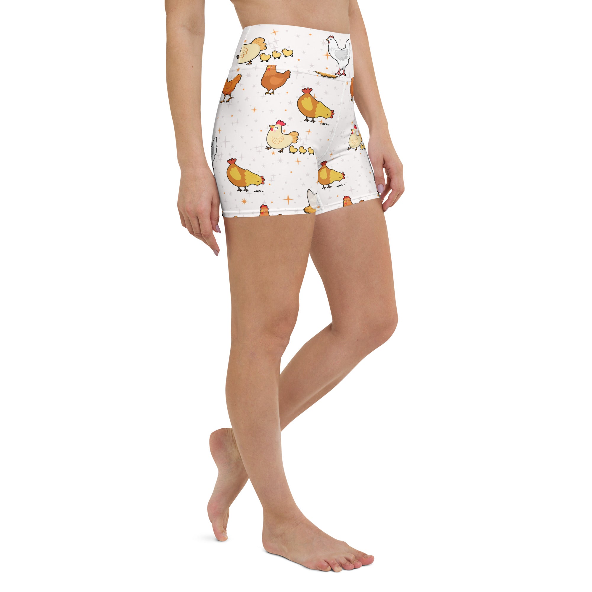 White high waisted buttery soft women’s yoga shorts with a playful yellow orange and white cartoon chicken pattern