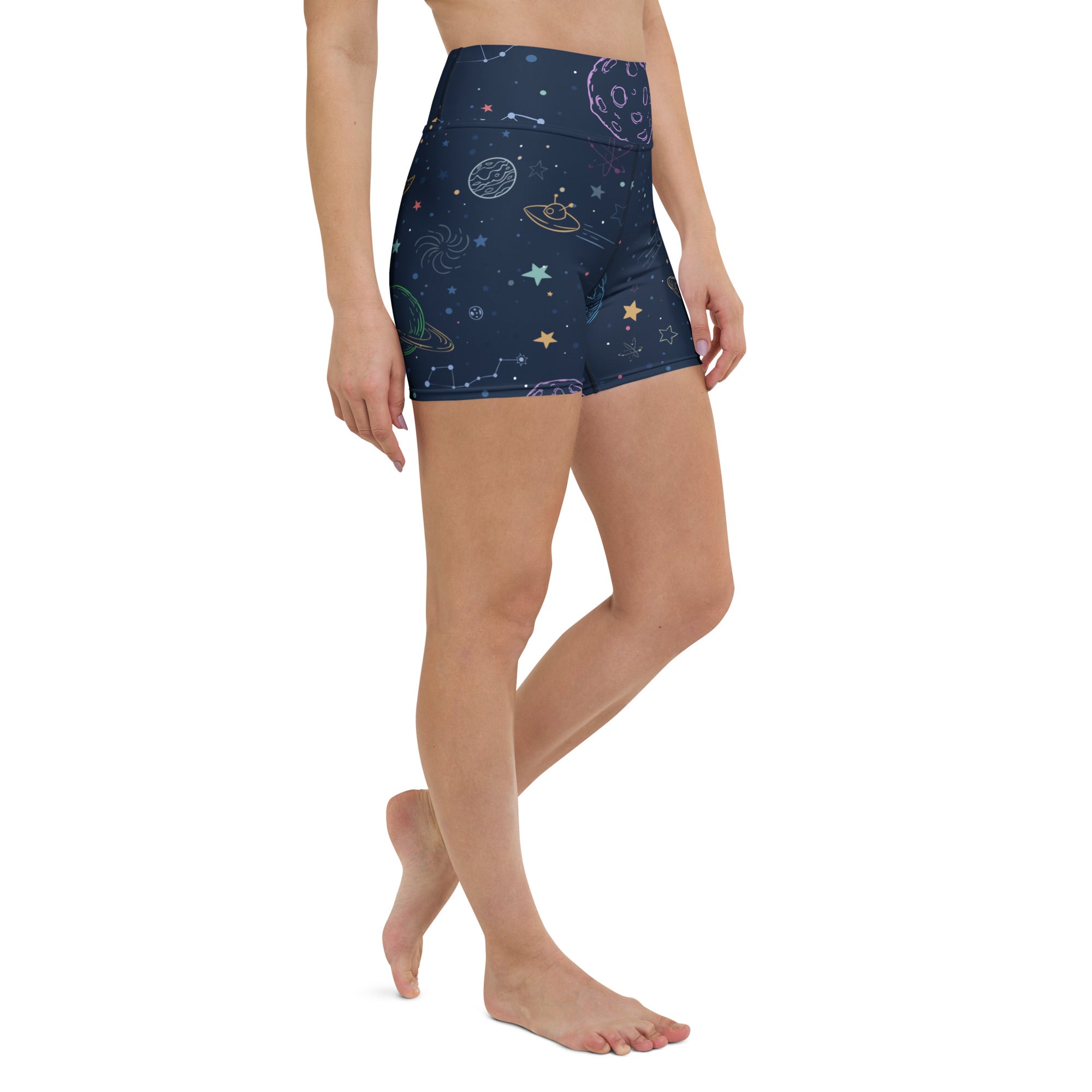 Dark blue high waisted buttery soft women’s yoga shorts with pastel galaxy space print featuring planets stars and ufos
