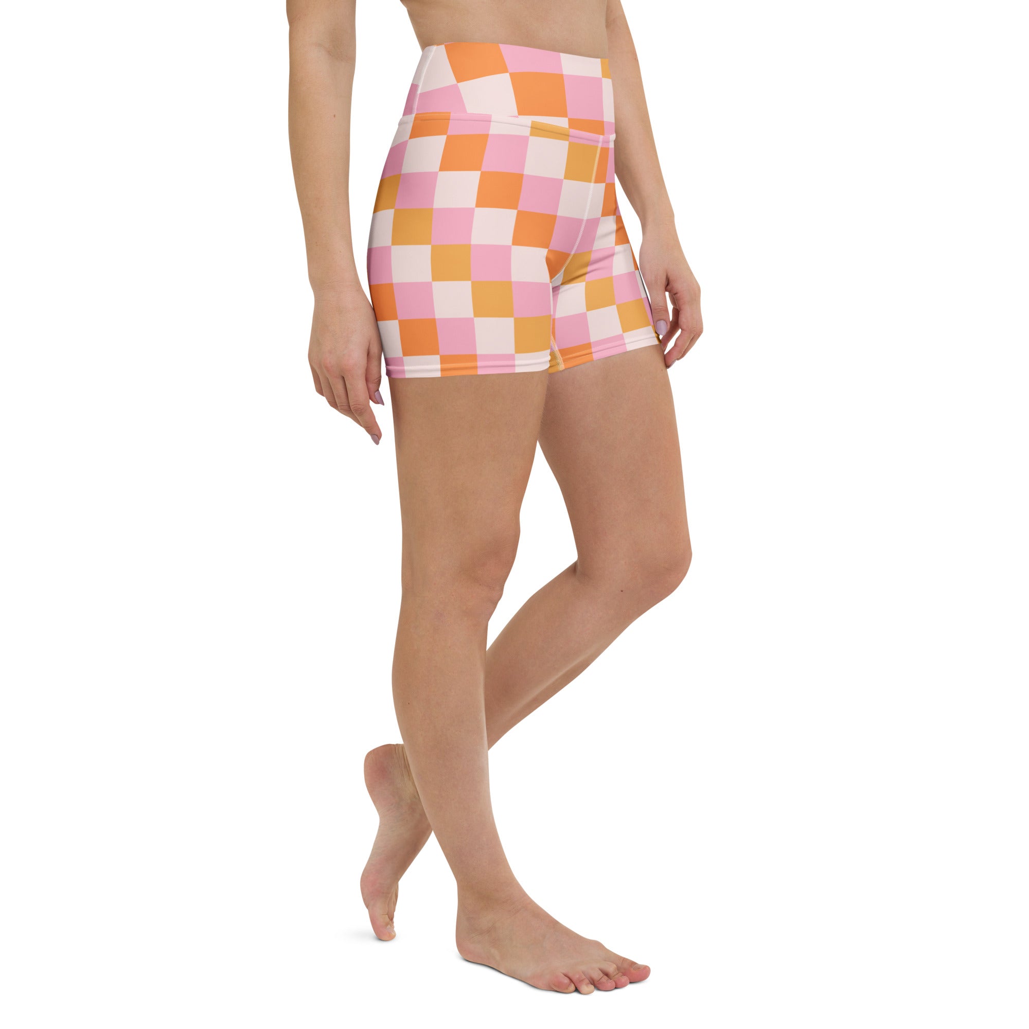 Women’s high waisted pink and orange checkered yoga shorts made from buttery soft stretchy fabric for active wear