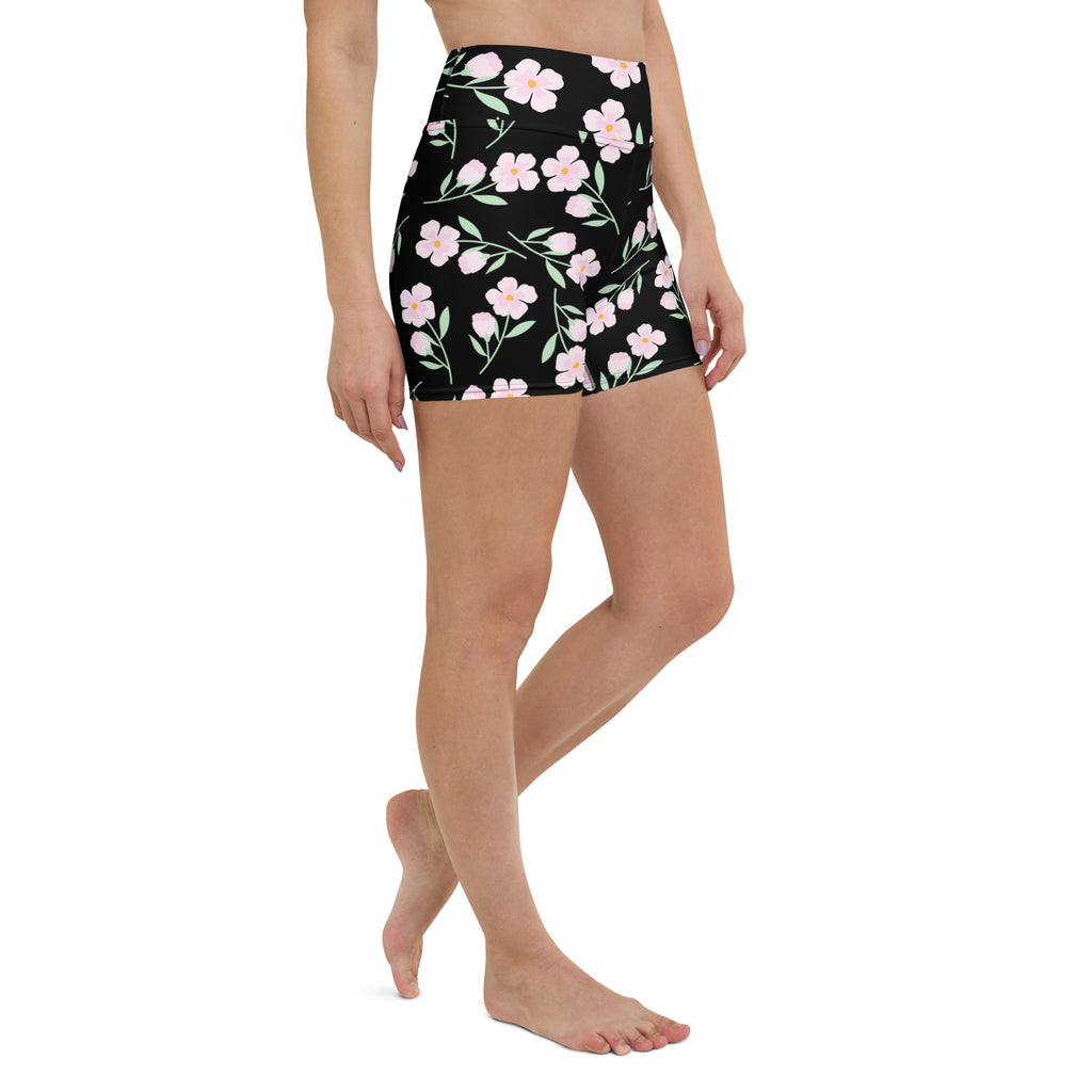 Women’s black high waisted buttery soft yoga shorts with delicate pink floral and green stem pattern