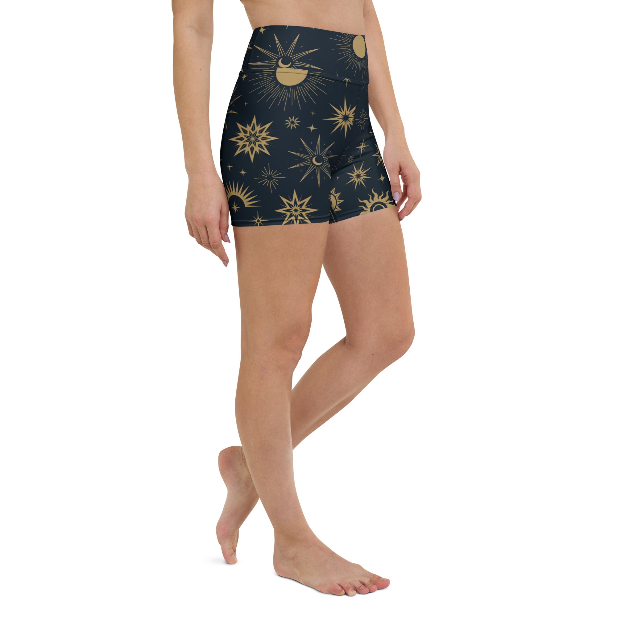 Dark blue high waisted buttery soft women’s yoga shorts with gold celestial sun moon and star pattern