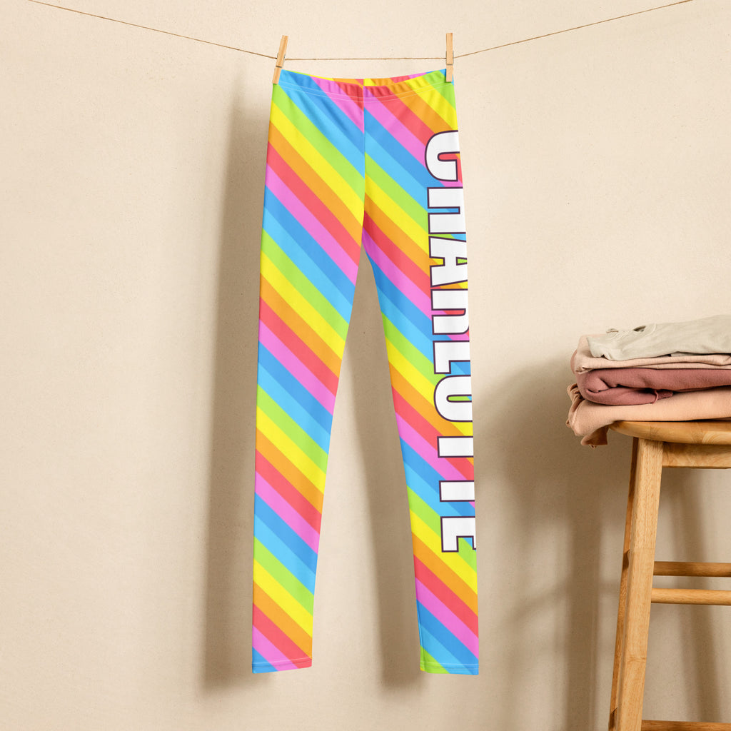 Girls custom name buttery soft leggings with rainbow stripes and charlotte printed vertically in bold white letters