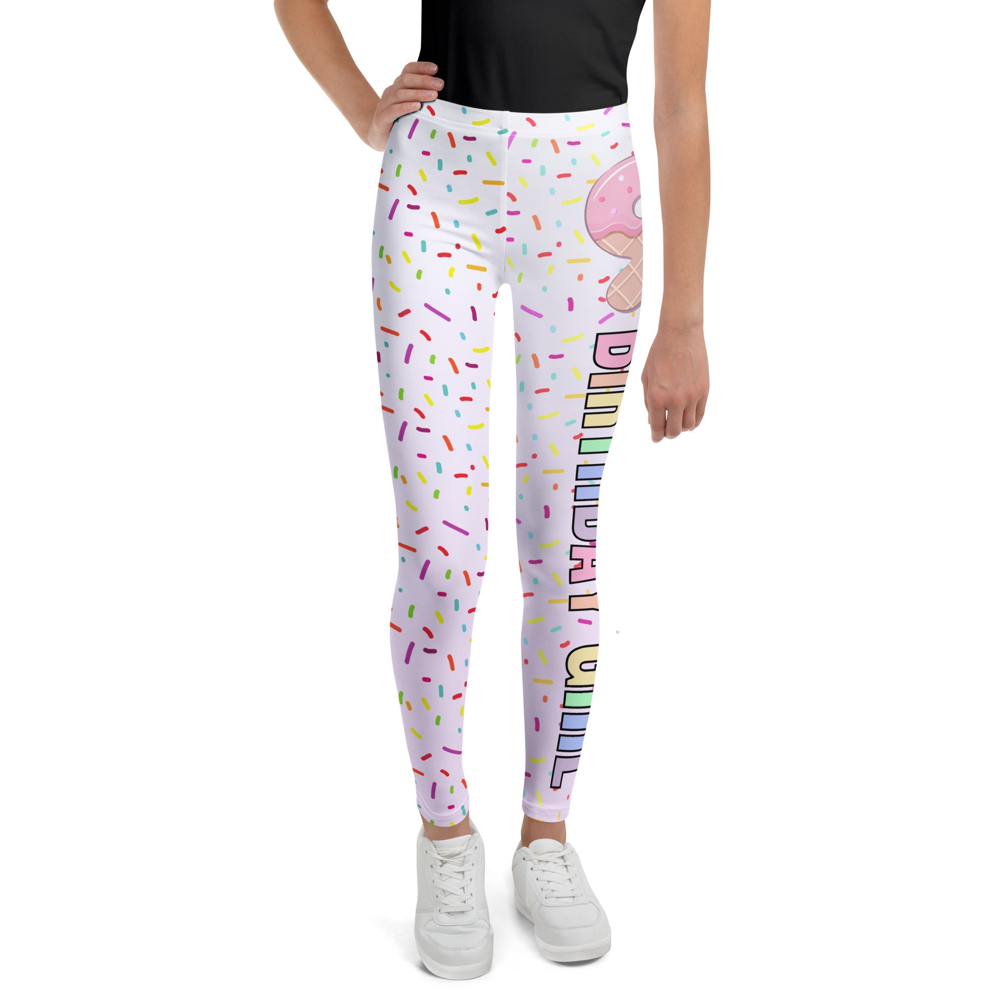 White buttery soft leggings with colorful sprinkles and a pink donut graphic with rainbow birthday wish text