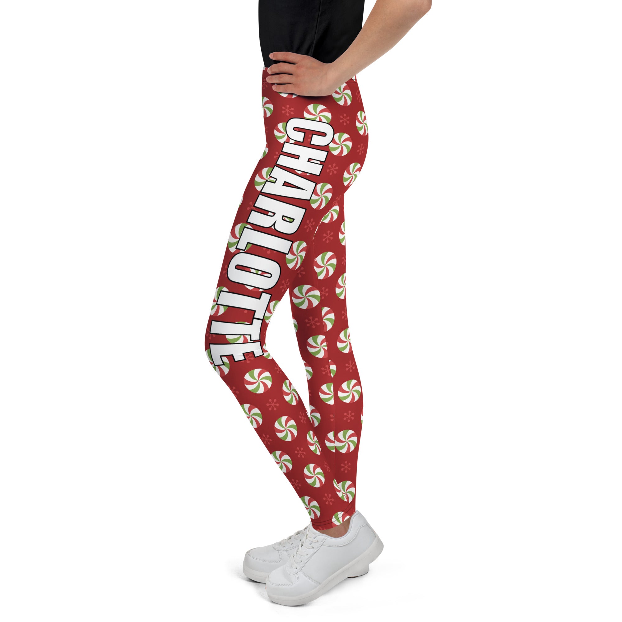 Girls custom name Christmas peppermint themed red buttery soft leggings with green and white candy pattern and vertical name