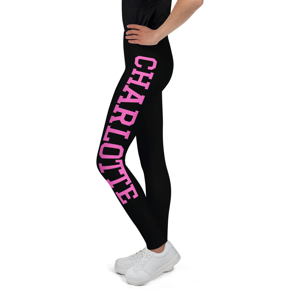 Black girls sports leggings with bold pink charlotte varsity font lettering on outer thigh buttery soft fabric