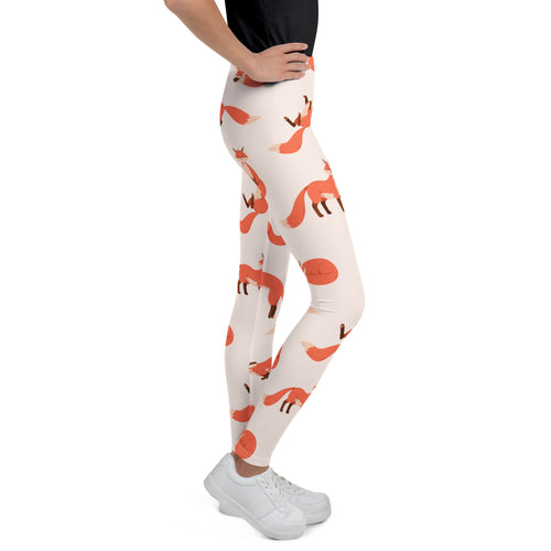Girls custom name fox buttery soft leggings in cream with a playful orange fox pattern in various poses