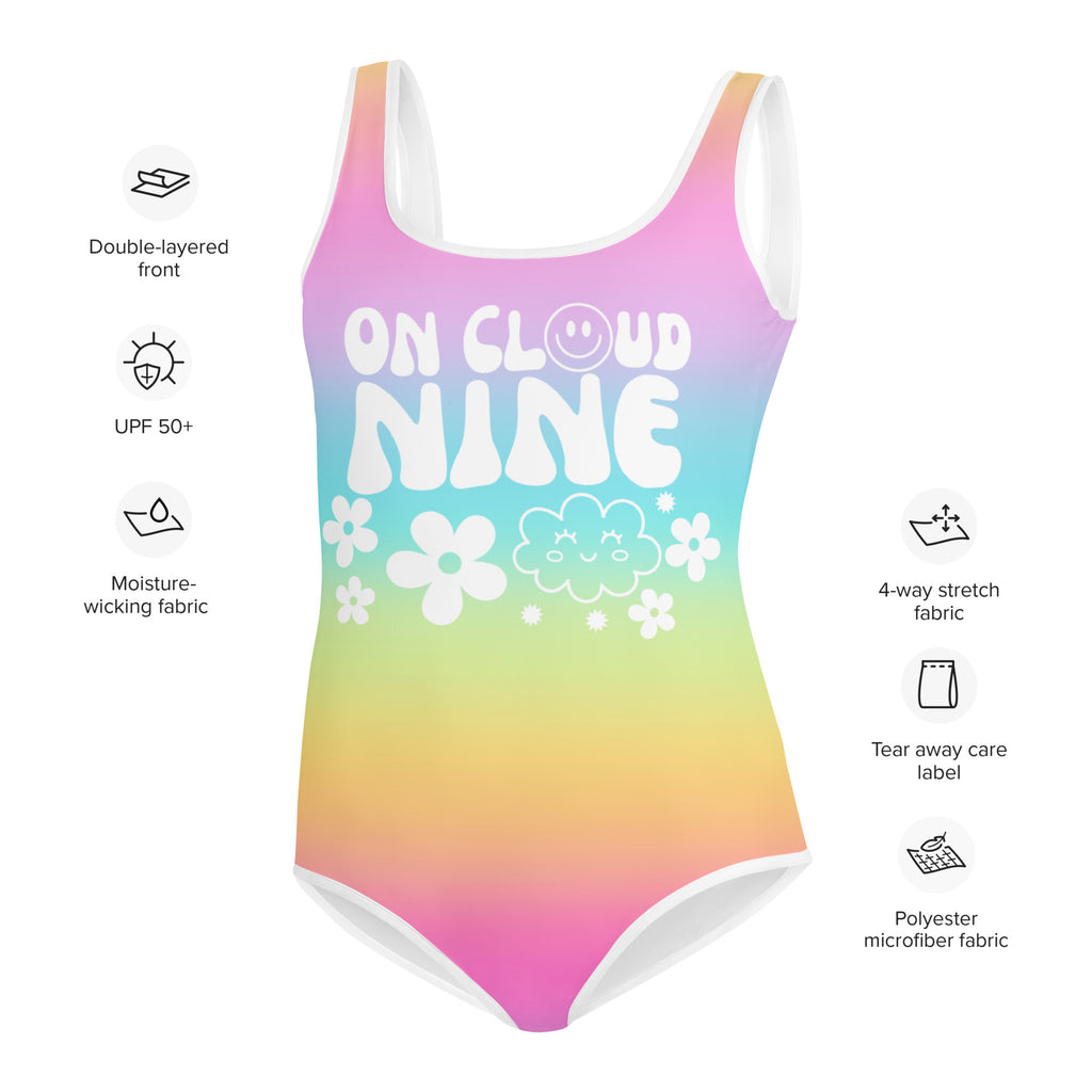 Girls on cloud 9 vibrant rainbow gradient one-piece swimsuit with white text and floral clouds made from polyester microfiber