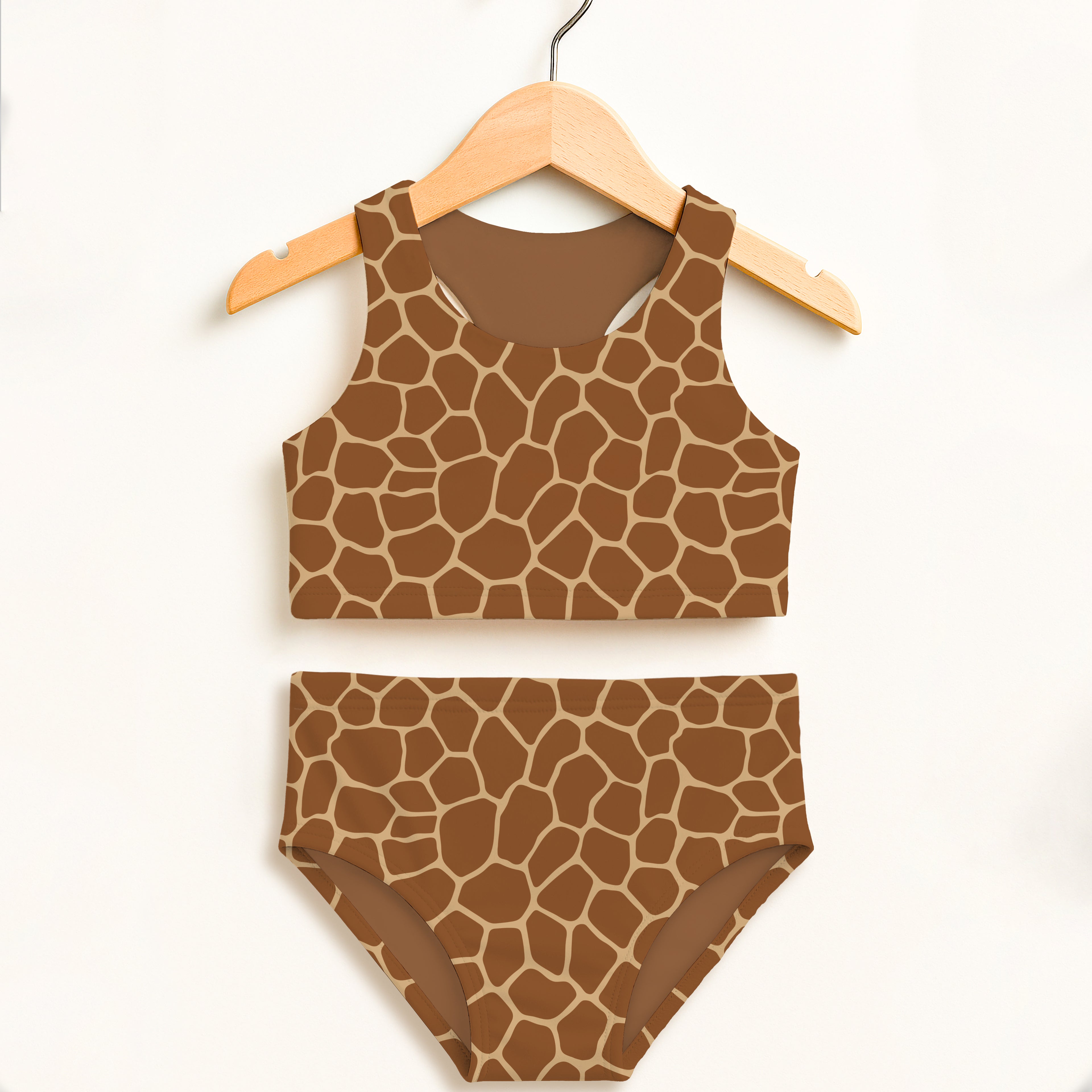 Girls giraffe print two piece swimsuit with brown and tan pattern featuring tank top and high waisted bottoms