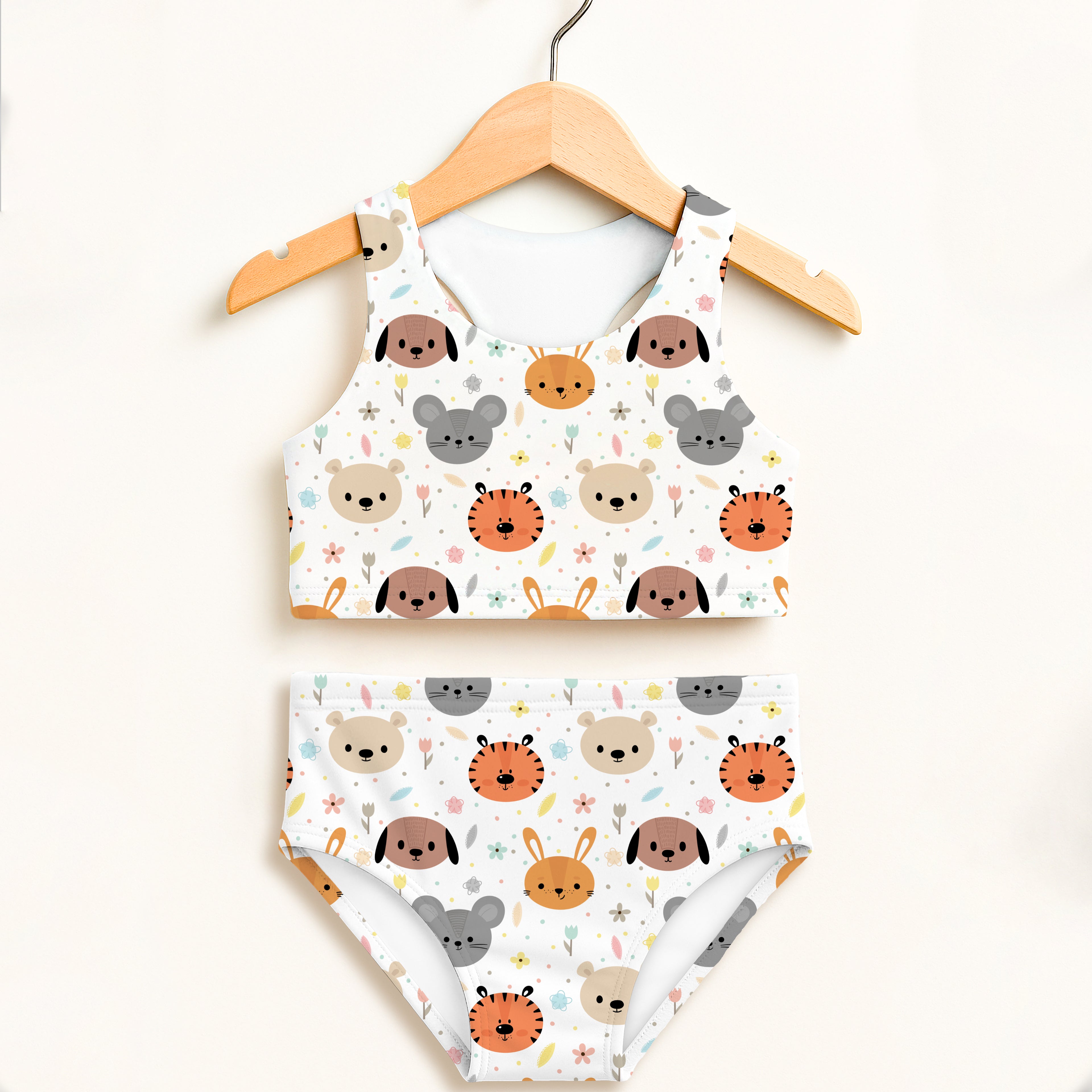 White two-piece swimsuit for girls with cute cartoon animal faces in soft earth tones and double layered upf 50+ fabric