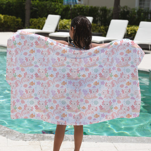 A white girls axolotl towel with a playful pink and pastel axolotl seashell star and fish pattern