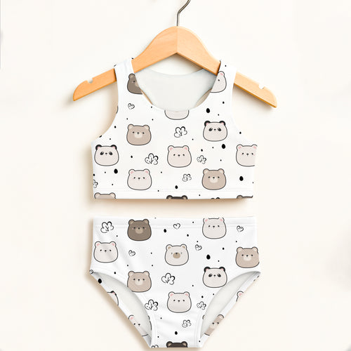White two-piece girls swimsuit with playful gray and beige bear pattern, hearts, dots, double layered, upf 50+ high waisted comfort
