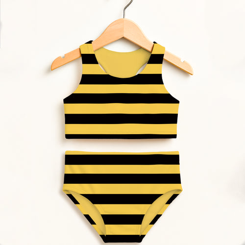 Yellow and black striped girls bee stripe two piece swimsuit hanging on wooden hanger with upf 50+ sun protection
