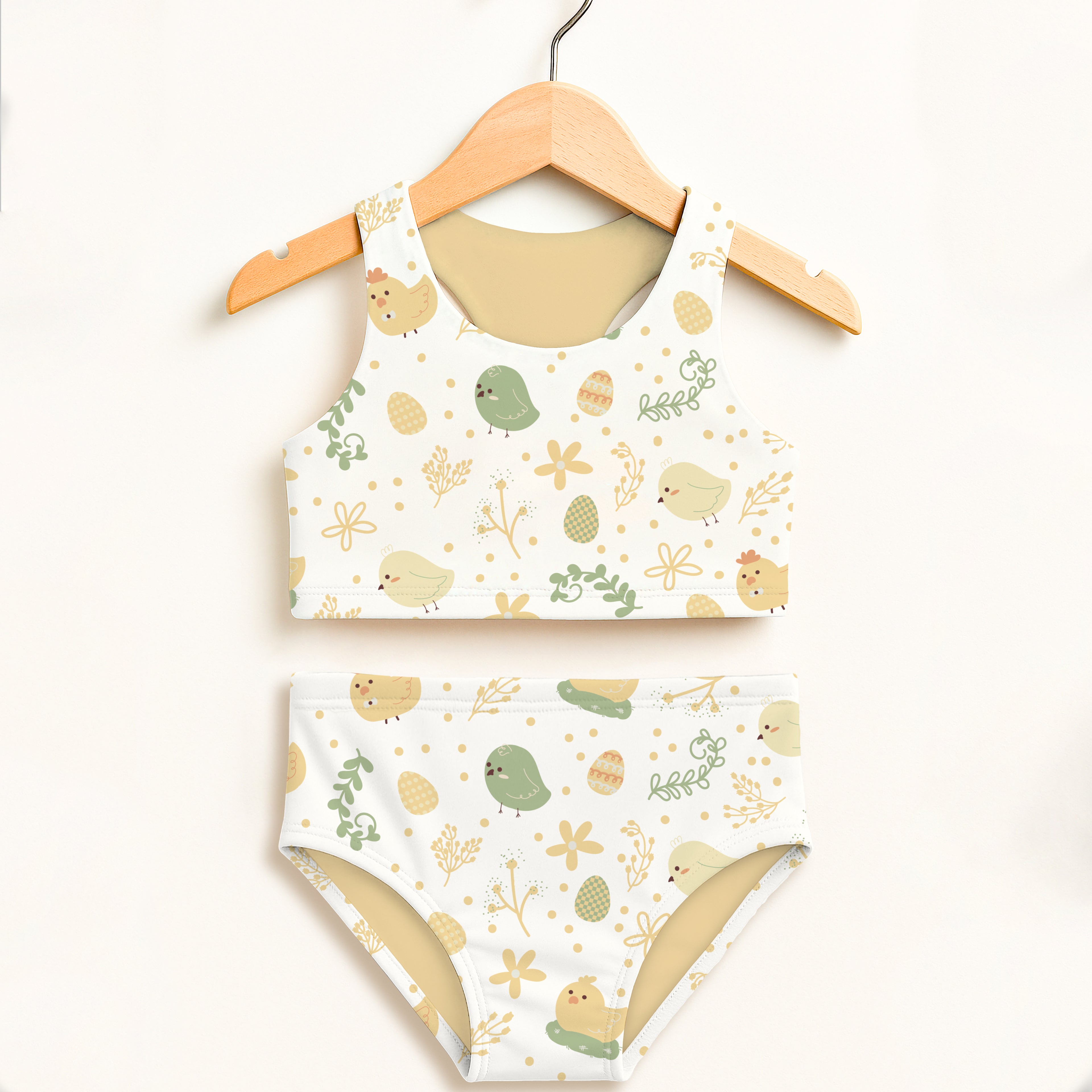 White girls chick and easter egg two piece swimsuit with playful pattern and upf 50 plus double layered fabric