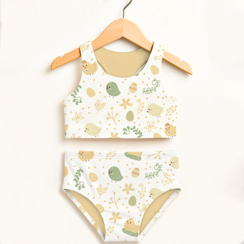 White girls chick and easter egg two piece swimsuit with playful pattern and upf 50 plus double layered fabric