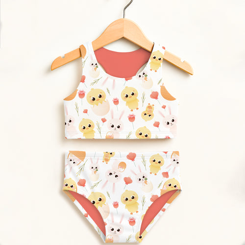 Girls chick and bunny two piece swimsuit in white and coral with cartoon chicks bunnies and flowers double layered upf 50+
