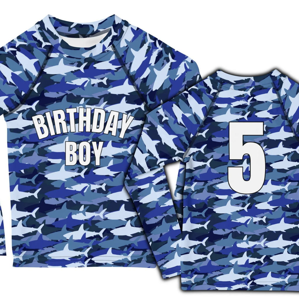 Blue and white shark camouflage long-sleeved rash guard with birthday boy on front and number 5 on back side