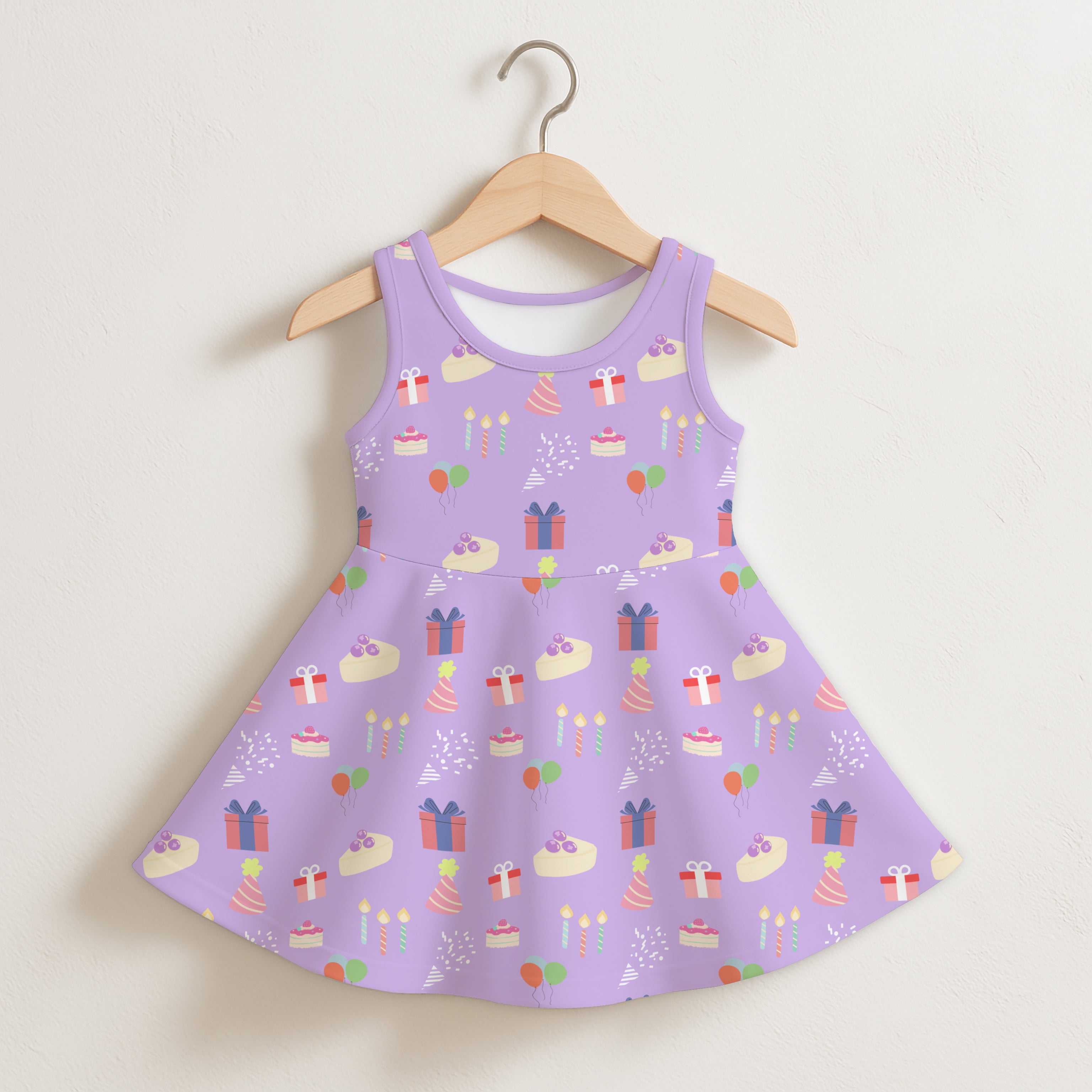 Girls purple birthday pattern sleeveless dress in lavender with a flared skirt and pastel birthday-themed prints