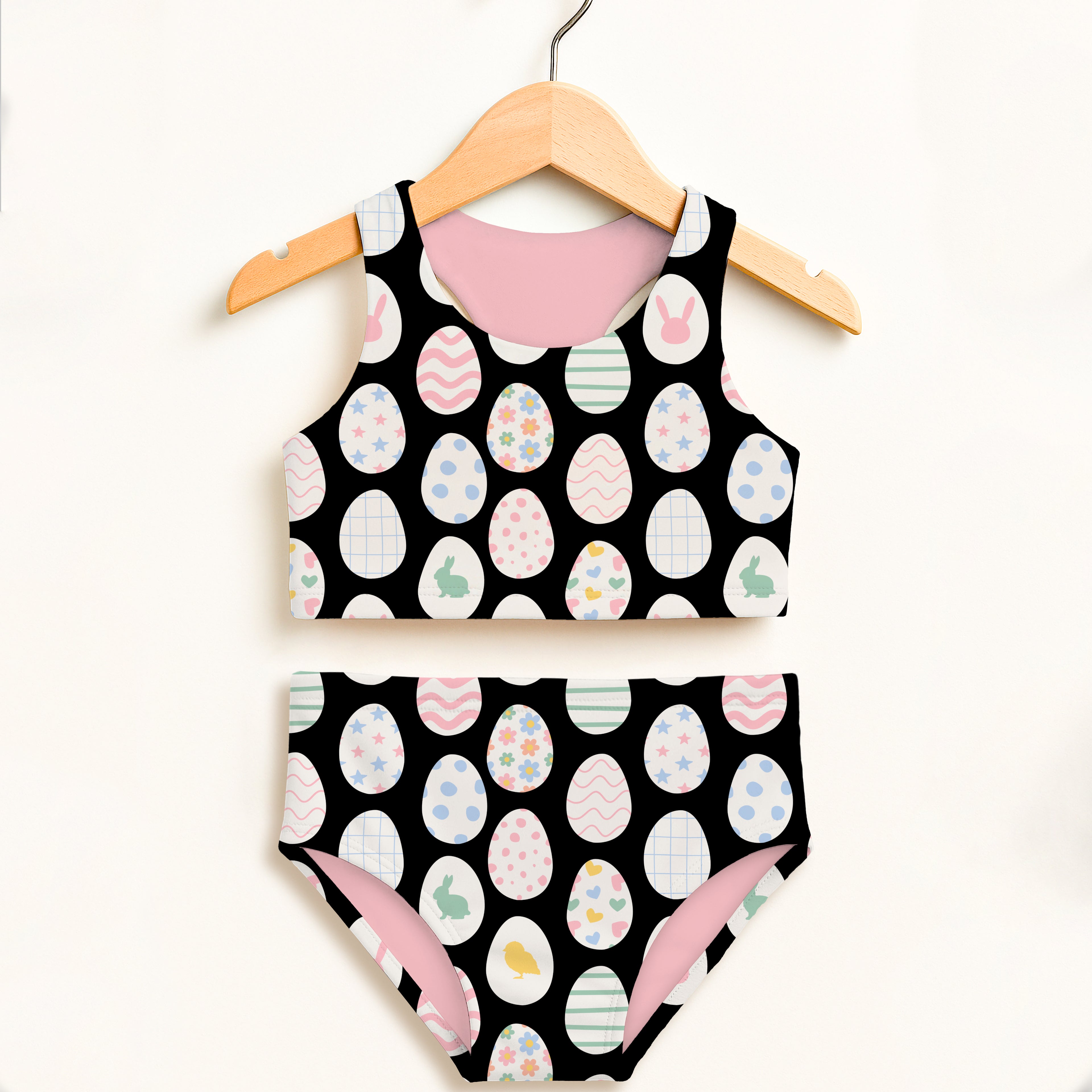 Girls black and pink easter egg two piece swimsuit with colorful eggs and bunnies pattern and UPF 50+ high waisted comfort