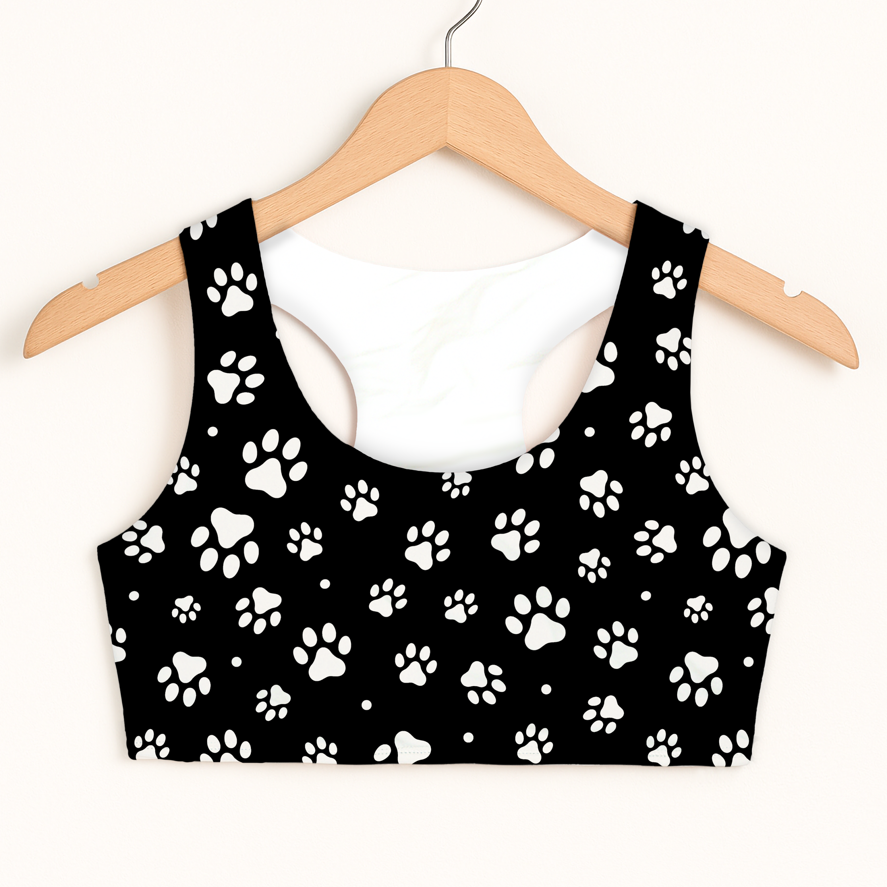 Black girls paw print sports bra with quick drying double layered comfort hanging on wooden hanger