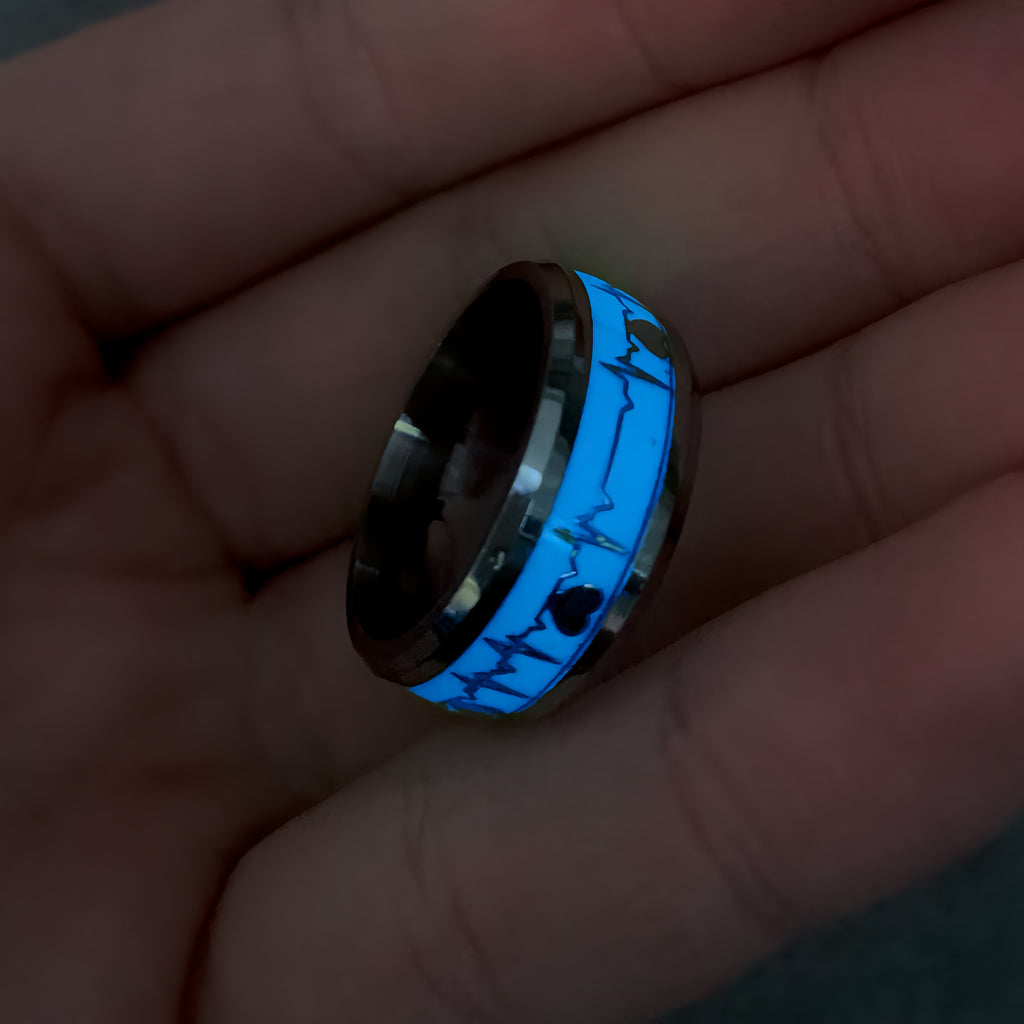 Glowing blue ring on a hand